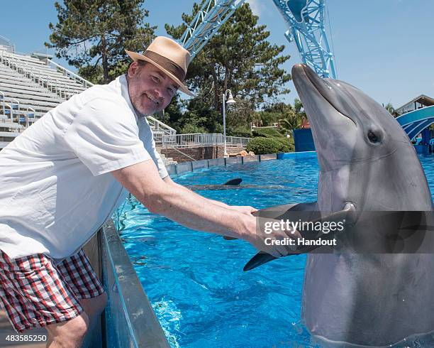 In this handout photo provided by SeaWorld San Diego, actor and comedian David Koechner spent a day with his family at SeaWorld San Diego where he...