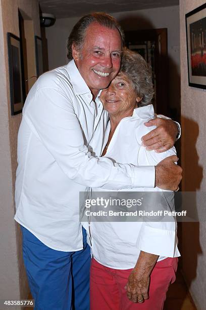 Humorist Michel Leeb and President of Ramatuelle Festival Jacqueline Franjou pose Backstage after the 'Michel Leeb Part en Live !' show, accompanied...