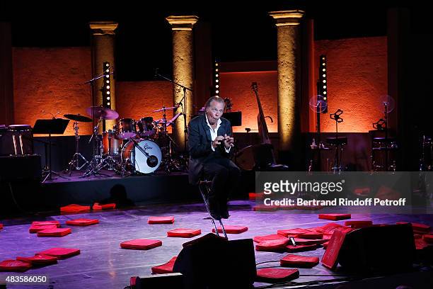 Humorist Michel Leeb performs in 'The typewriter' after the traditional throw of cushions at the final of his 'Michel Leeb Part en Live !' show,...