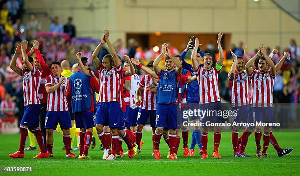 Club Atletico de Madrid applaud their fans as they celebrate victory during the UEFA Champions League Quarter Final second leg match between Club...