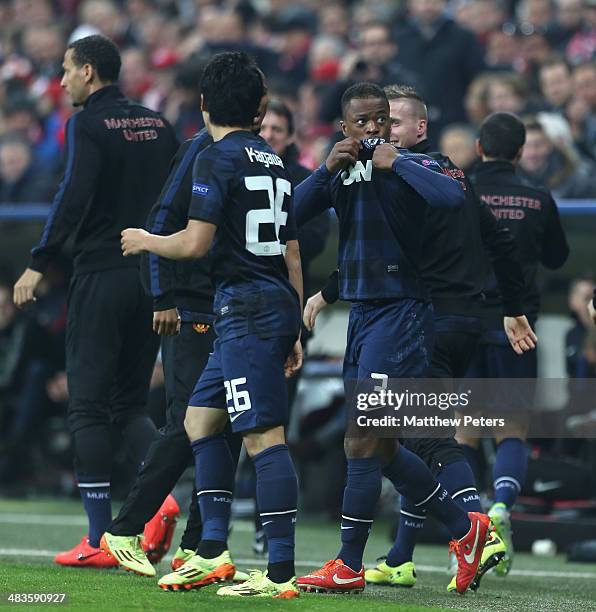 Patrice Evra of Manchester United celebrates scoring their first goal during the UEFA Champions League quarter-final second leg match between Bayern...