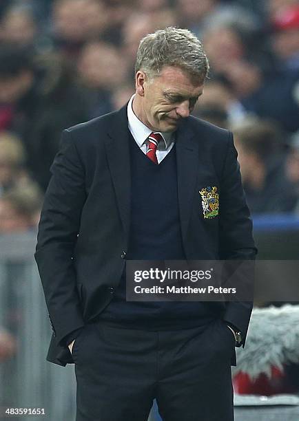 Manager David Moyes of Manchester United watches from the touchline during the UEFA Champions League quarter-final second leg match between Bayern...