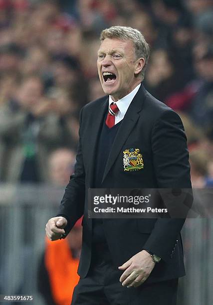 Manager David Moyes of Manchester United watches from the touchline during the UEFA Champions League quarter-final second leg match between Bayern...