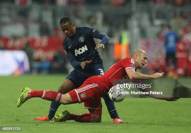 Patrice Evra of Manchester United in action with Arjen Robben of Bayern Munich during the UEFA Champions League quarter-final second leg match...