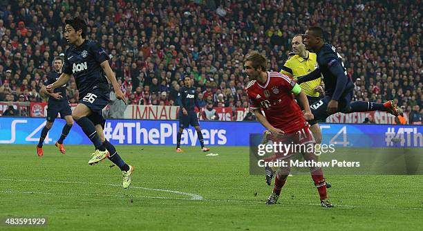 Patrice Evra of Manchester United scores their first goal during the UEFA Champions League quarter-final second leg match between Bayern Munich and...