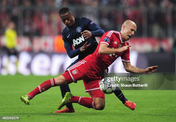 Patrice Evra of Manchester United tackles Arjen Robben of Bayern Muenchen during the UEFA Champions League Quarter Final second leg match between FC...