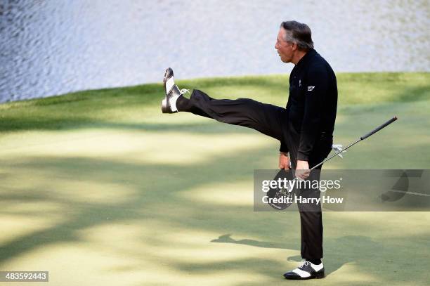 Gary Player salutes the gallery on the ninth green during the 2014 Par 3 Contest prior to the start of the 2014 Masters Tournament at Augusta...