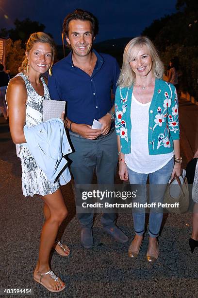 Yannick Bollore standing between his wife Chloe and actress Anais Jeanneret, Vincent Bollore's wife , attend the 'Fabrice Luchini - Poesie ?' show...