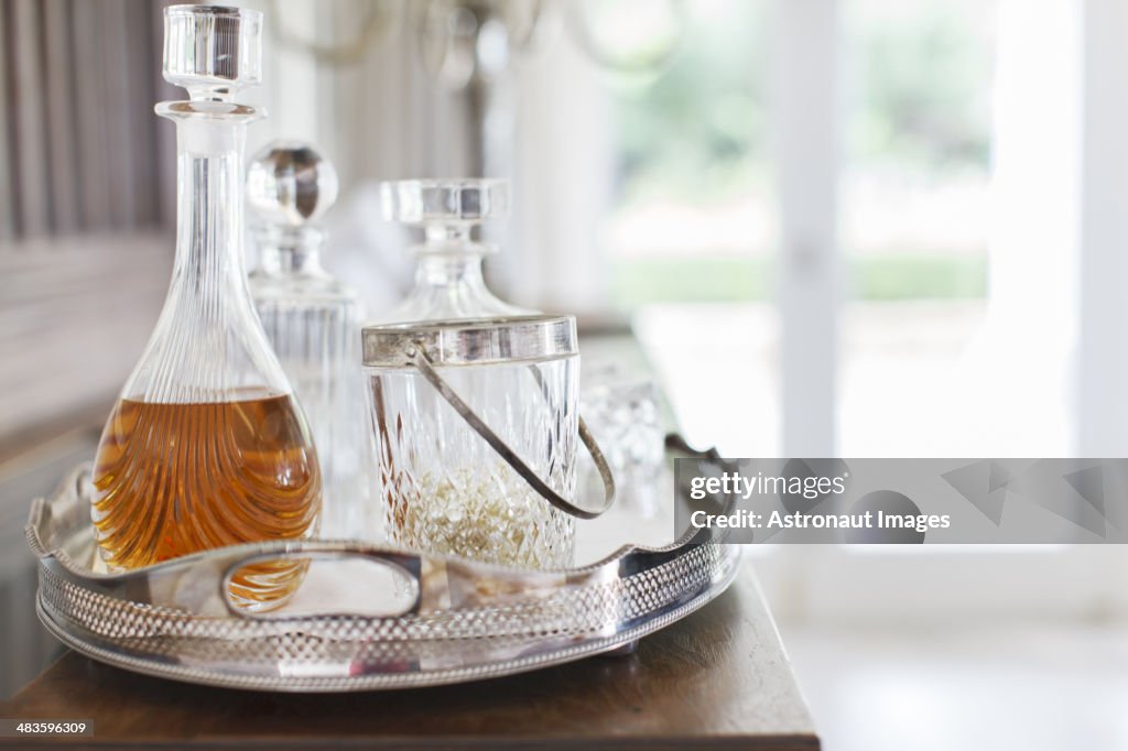 Crystal alcohol decanters on silver tray