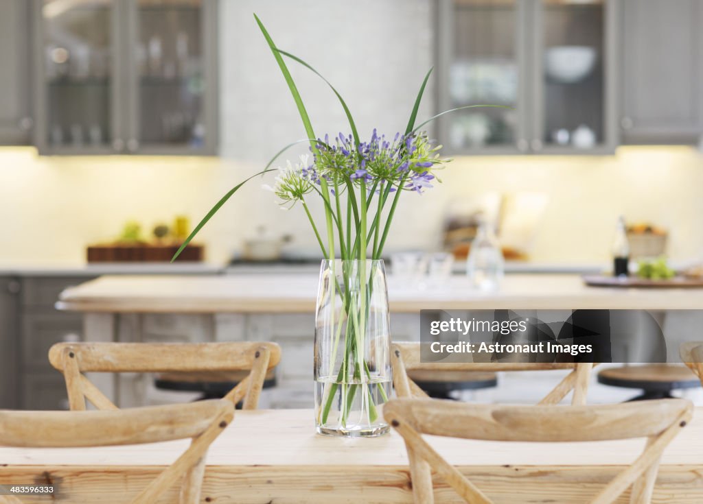 Flowers in vase on wooden table