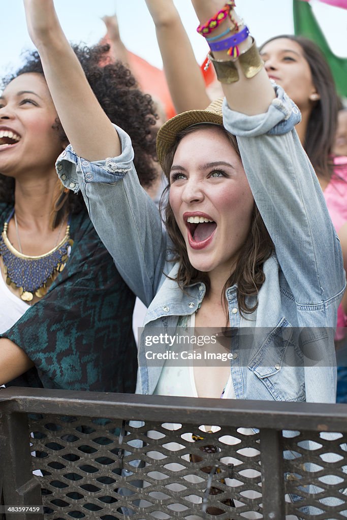 Woman cheering at music festival