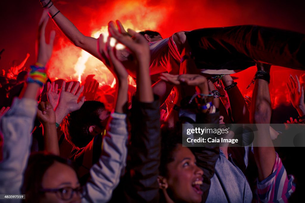 Man crowd surfing at music festival