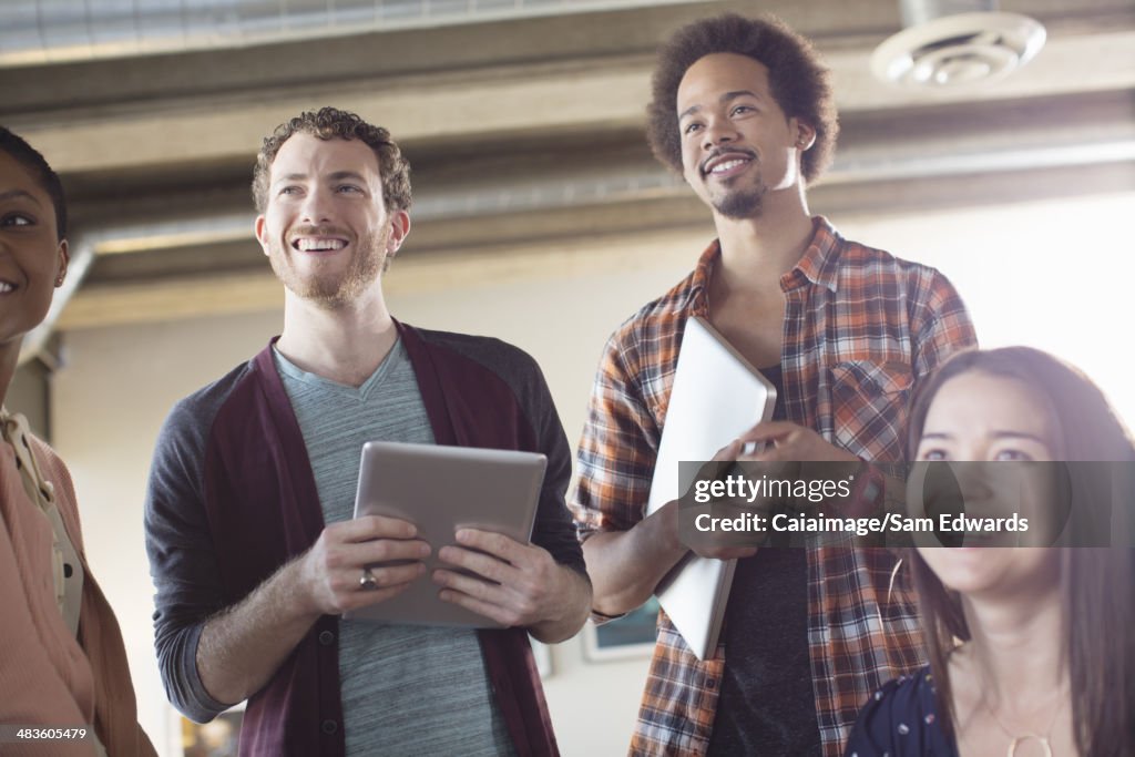 Casual business people smiling in meeting