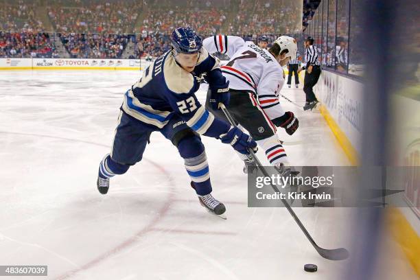 Matt Frattin of the Columbus Blue Jackets controls the puck during the game against the Chicago Blackhawks on April 4, 2014 at Nationwide Arena in...