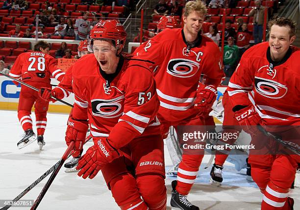 Jeff Skinner of the Carolina Hurricanes skates during pregame warmups with Eric Staal and Drayson Bowman prior to their NHL game against the New...