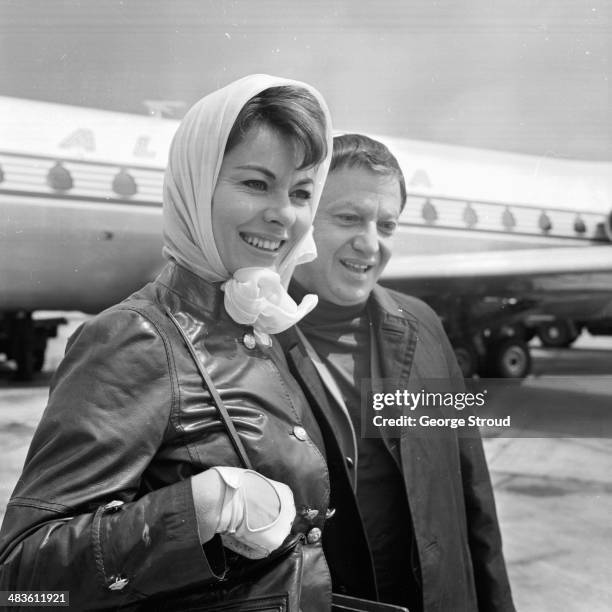 Actress Anne Heywood with her husband Raymond Stross, arriving at London Airport, 19th May 1968.