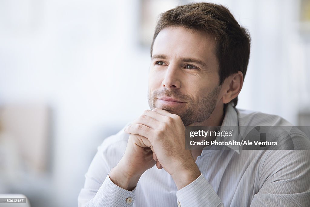 Mid-adult man in thought, portrait