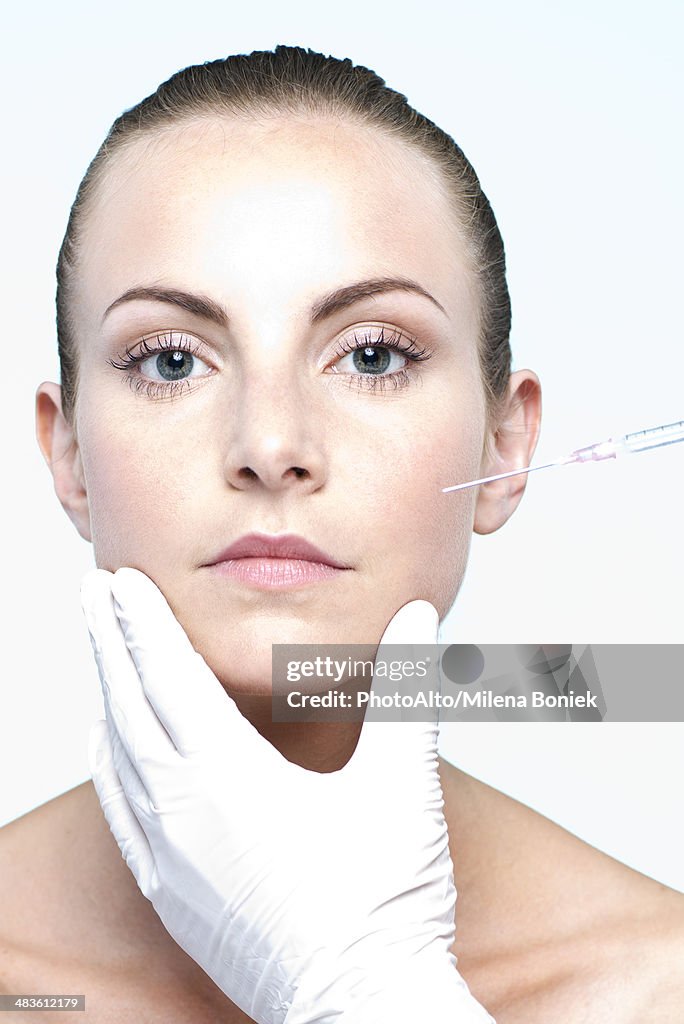 Woman receiving collagen injection