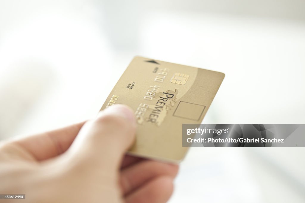 Hand holding credit card