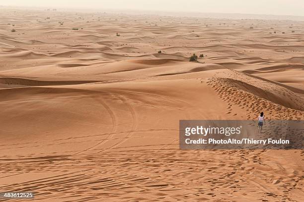 girl running in desert - hot arabic girl stock pictures, royalty-free photos & images