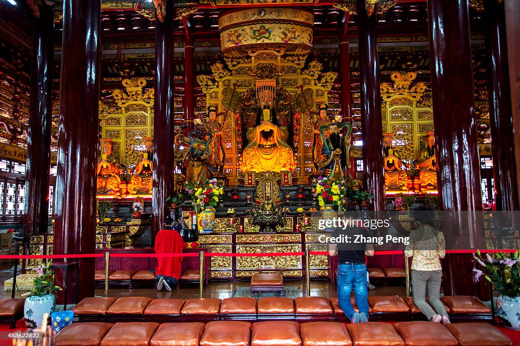 Believers kneel and pray to the Jade Emperor in the Lingxiao...