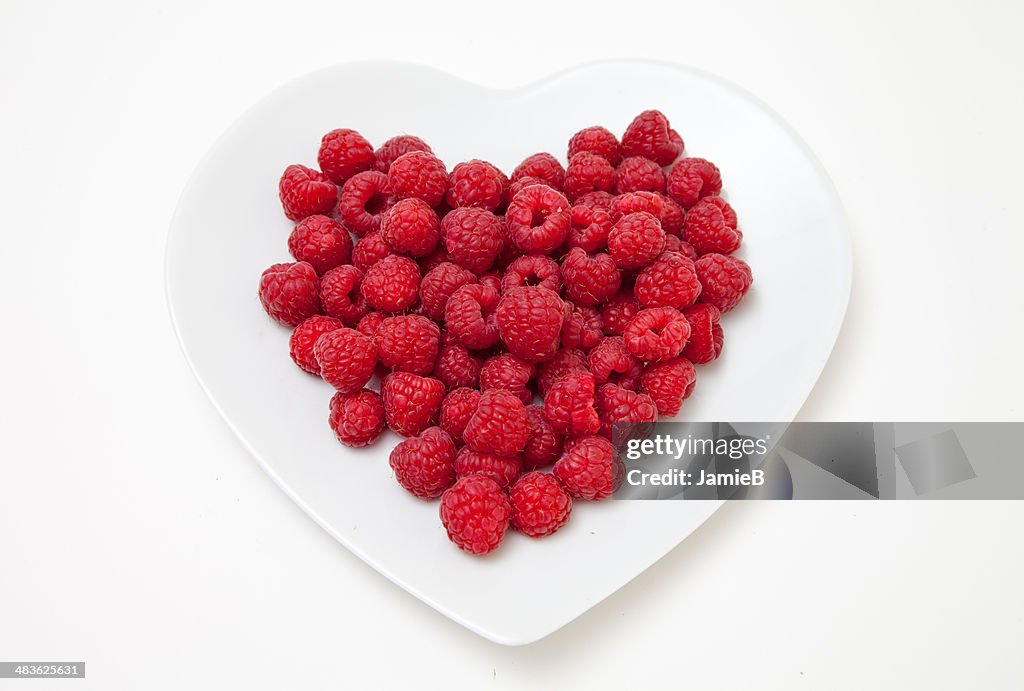Raspberries on heart shaped plate
