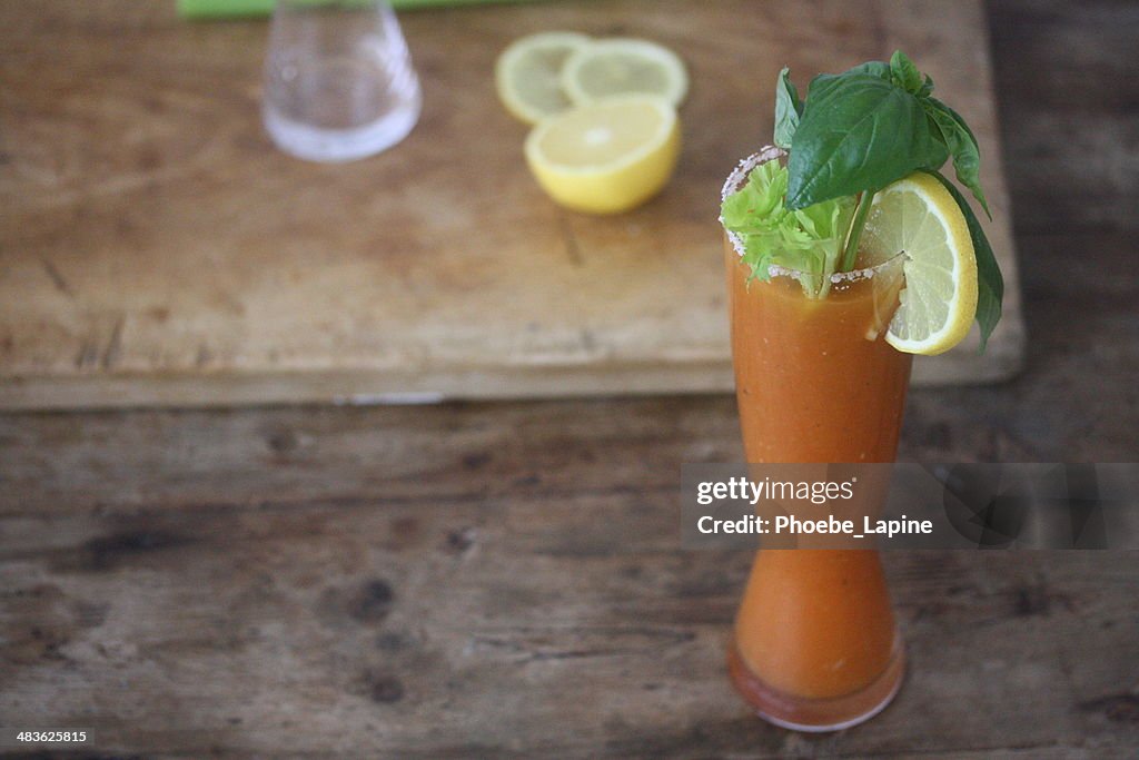 Bloody Mary Cocktail with lemon, celery, salt and basil