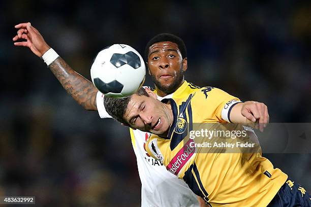 Nick Montgomery of the Mariners contests the header against Roly Bonevacia of the Phoenix during the FFA Cup match between Central Coast Mariners and...