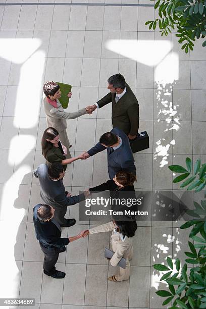 Closeup Of Business People Shaking Hands High-Res Stock Photo