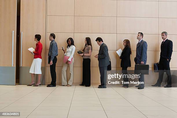 businesspeople standing in line  - lining up bildbanksfoton och bilder