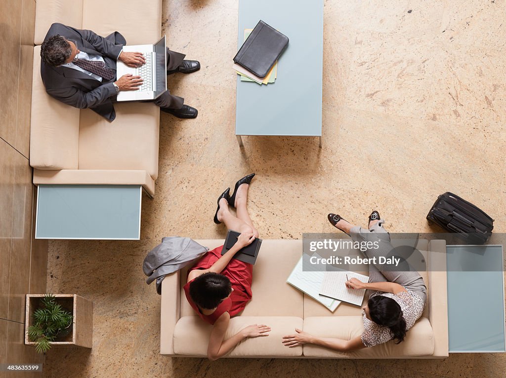 Business people working in lobby