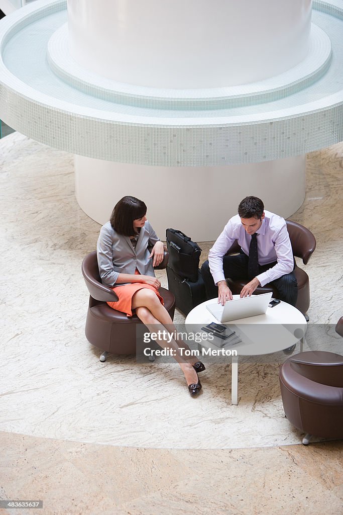 Business people working in lobby