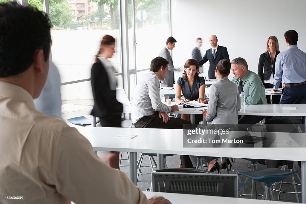 Businesspeople working in corporate training facility