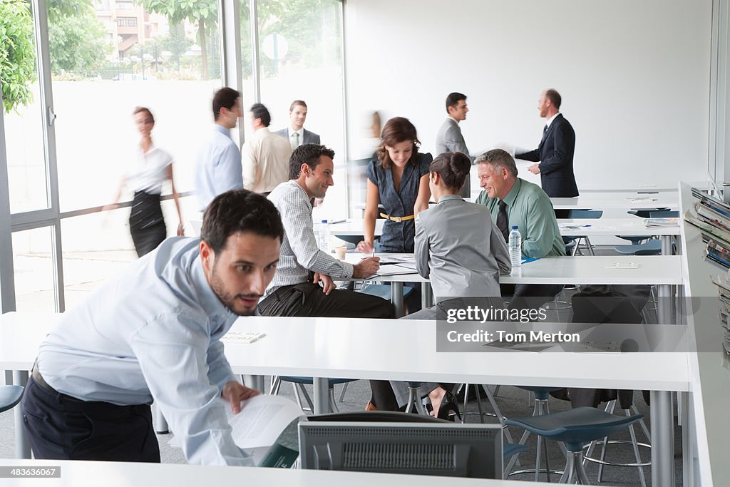Businesspeople working in corporate training facility