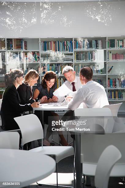 businesspeople in office meeting - team effort stock pictures, royalty-free photos & images