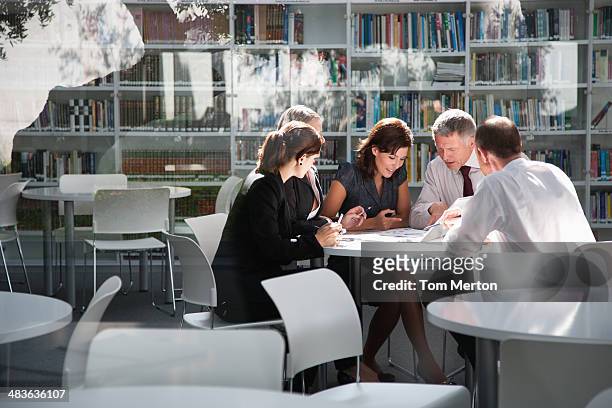 businesspeople in office meeting - cultures stock pictures, royalty-free photos & images