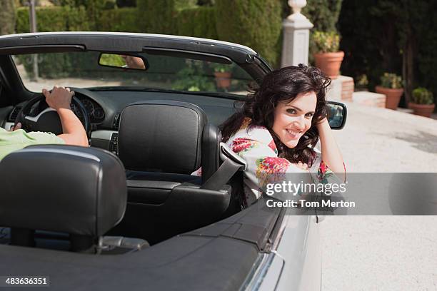 Couple Driving Convertible, Stockfoto