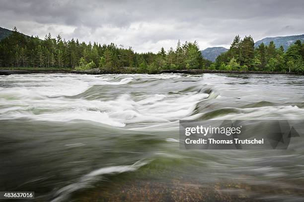 Vikeland, Norway Water flows in the river Otra through rapids on July 07, 2015 in Vikeland, Norway.