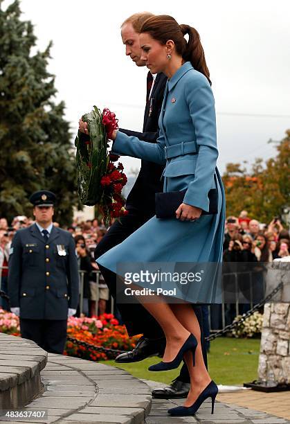 Prince William, Duke of Cambridge and Catherine, Duchess of Cambridge attend a ceremony at the war memorial in Seymour Square on April 10, 2014 in...