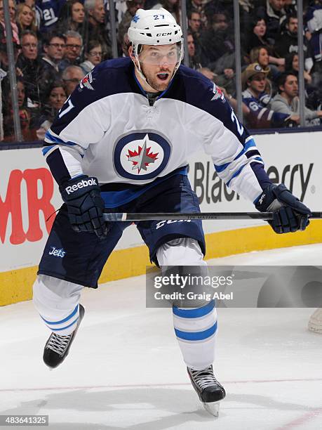 Eric Tangradi of the Winnipeg Jets skates during NHL game action against the Toronto Maple Leafs April 5, 2014 at the Air Canada Centre in Toronto,...