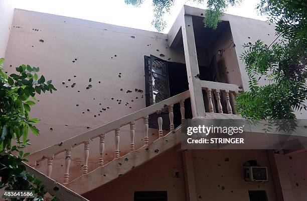 Picture taken on August 8, 2015 shows the bullet-riddled Byblos Hotel in Sevare, days after an attack killed 13 people. A deadly hostage drama at the...