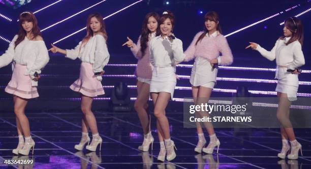 This photo taken on April 9, 2014 shows South Korean KPOP idol band "A-Pink" performing in the music variety program "MBC Show Champion" in Seoul....