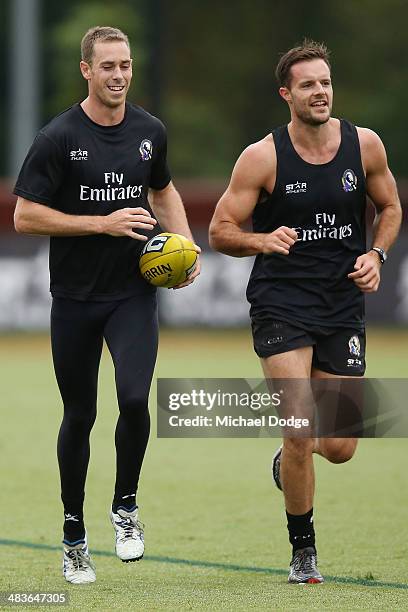 Nick Maxwell and Nathan Brown run laps during a Collingwood Magpies AFL training session at Olympic Park on April 10, 2014 in Melbourne, Australia.