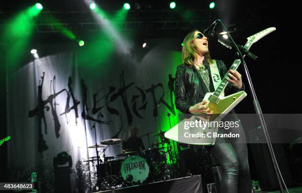 Arejay Hale and Lizzy Hale of Halestorm perform on stage at The Forum on April 9, 2014 in London, United Kingdom.