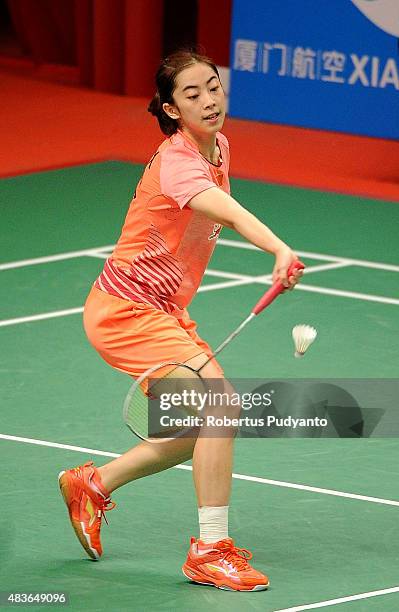 Wang Shixian of China competes against Iris Wang of USA in the 2015 Total BWF World Championship at Istora Senayan on August 11, 2015 in Jakarta,...