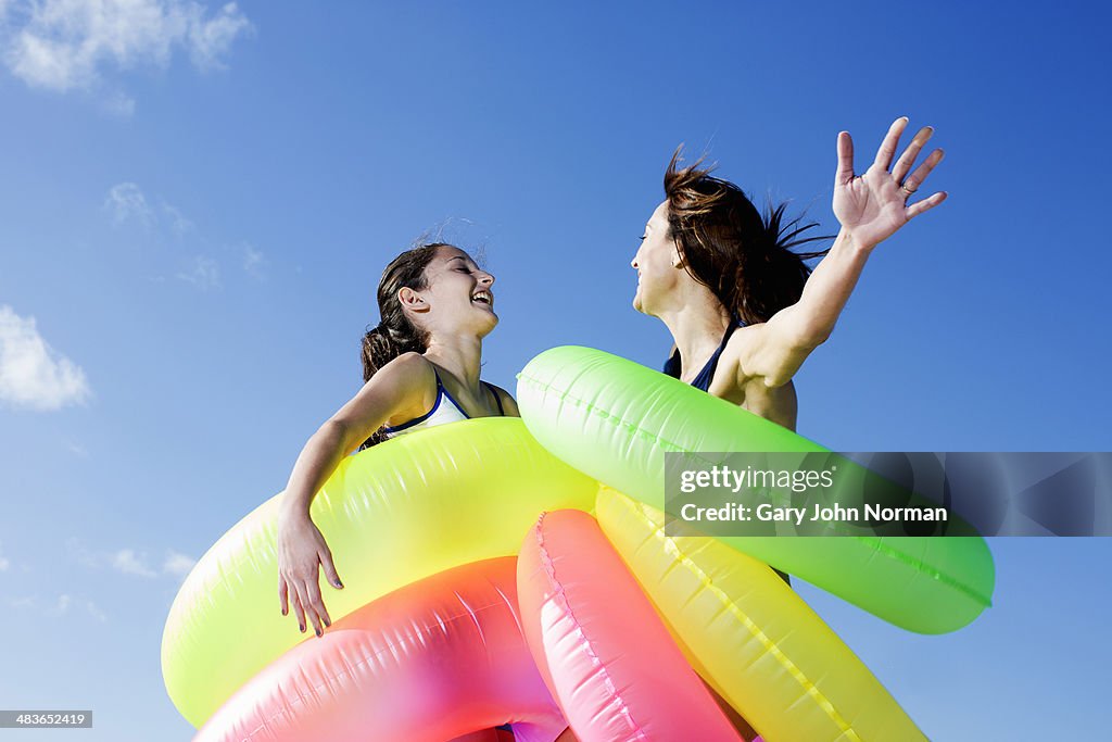 Mum and daughter having fun with rubber rings