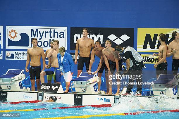 16th FINA World Championships: USA Conor Dwyer, Ryan Lochte, Reed Malone and Michael Weiss in pool watching replay during Men's 4x200M Freestyle...