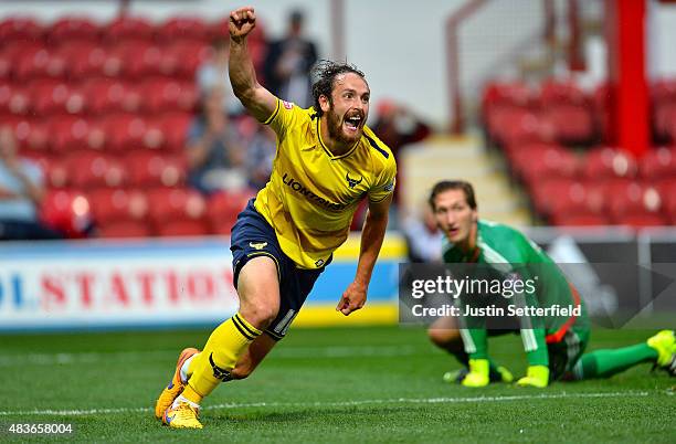 Danny Hylton of Oxford United celebrates scoring Oxfords 2nd goal during the Capital One Cup First Round match between Brentford and Oxford United at...