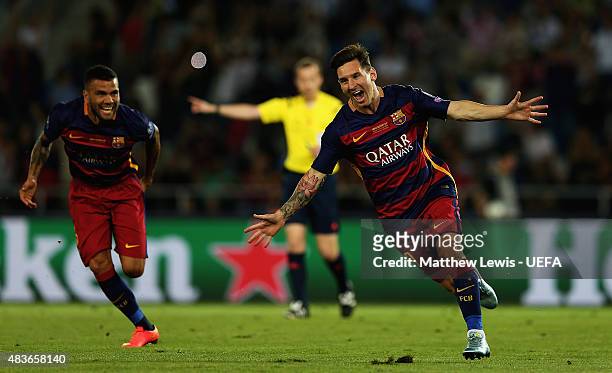 Lionel Messi of Barcelonacelebrates scoring his second goal by team mates during the UEFA Super Cup between Barcelona and Sevilla FC at Dinamo Arena...