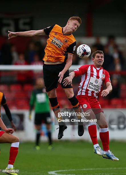 Sam Clucas of Hull City in action with Anthony Barry of Accrington Stanley during the Capital One Cup First Round match between Accrington Stanley...